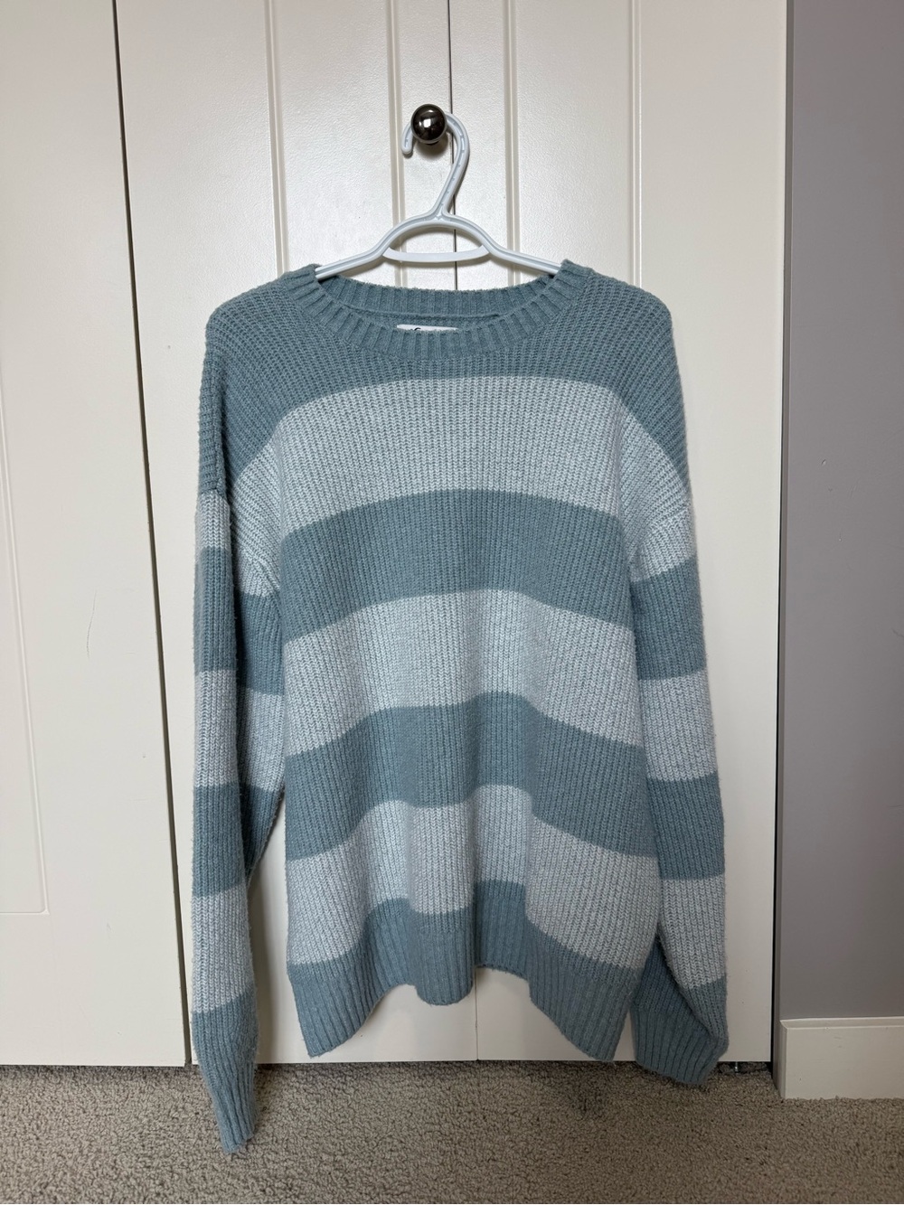 Hollister striped crewneck sweater featuring wide blue and light grey-white knit